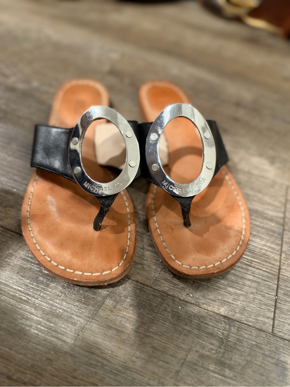 MICHAEL Michael Kors Black Leather Toe-Loop Sandals with Silver Ring